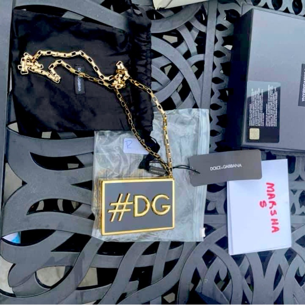 Dolce & Gabbana gold & black minaudiere/necklace.